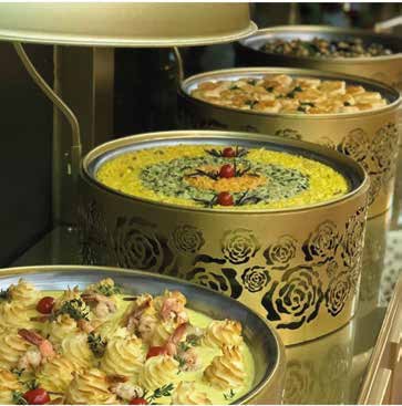 Buffet dishes presented in gold-toned serving containers