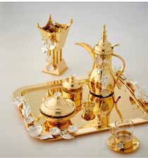 Gold-toned coffee service arranged on a serving tray
